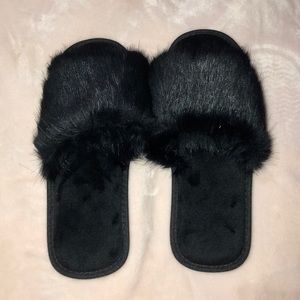 Women’s black furry slippers